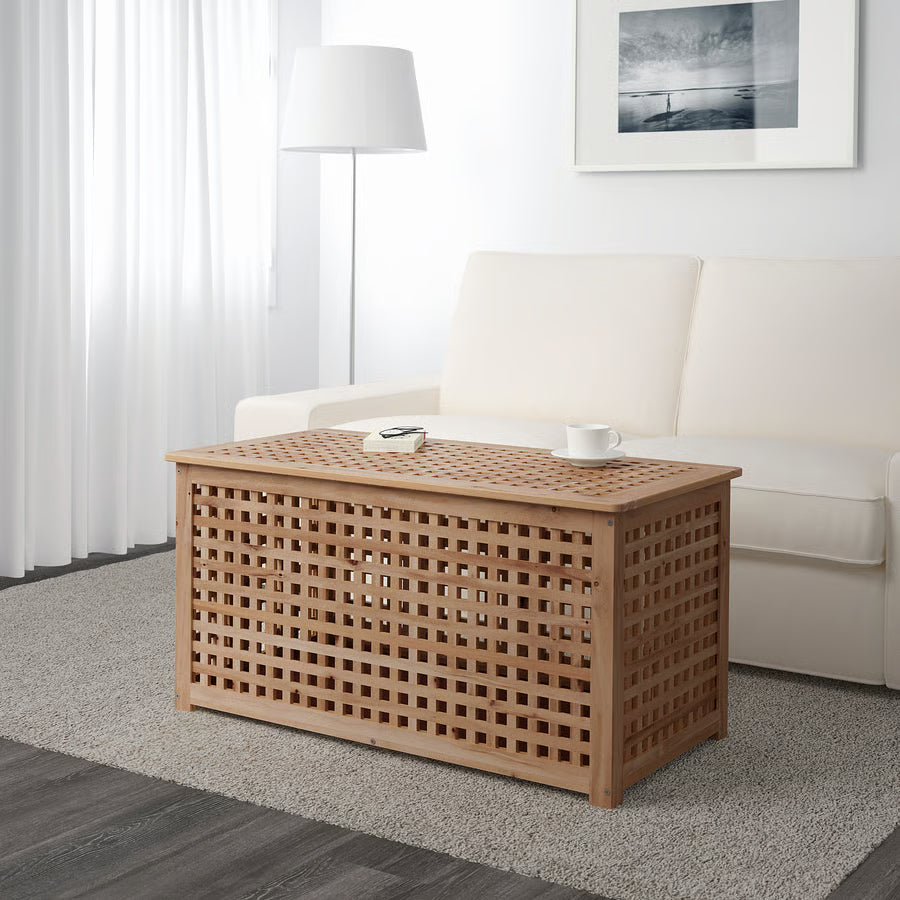 Wooden coffee table with lattice design in a living room setting.